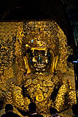 Myanmar's most famous Buddha image, 13ft high and covered in 6 inches of pure gold leaf, Mahamuni Paya, Mandalay, Myanmar  